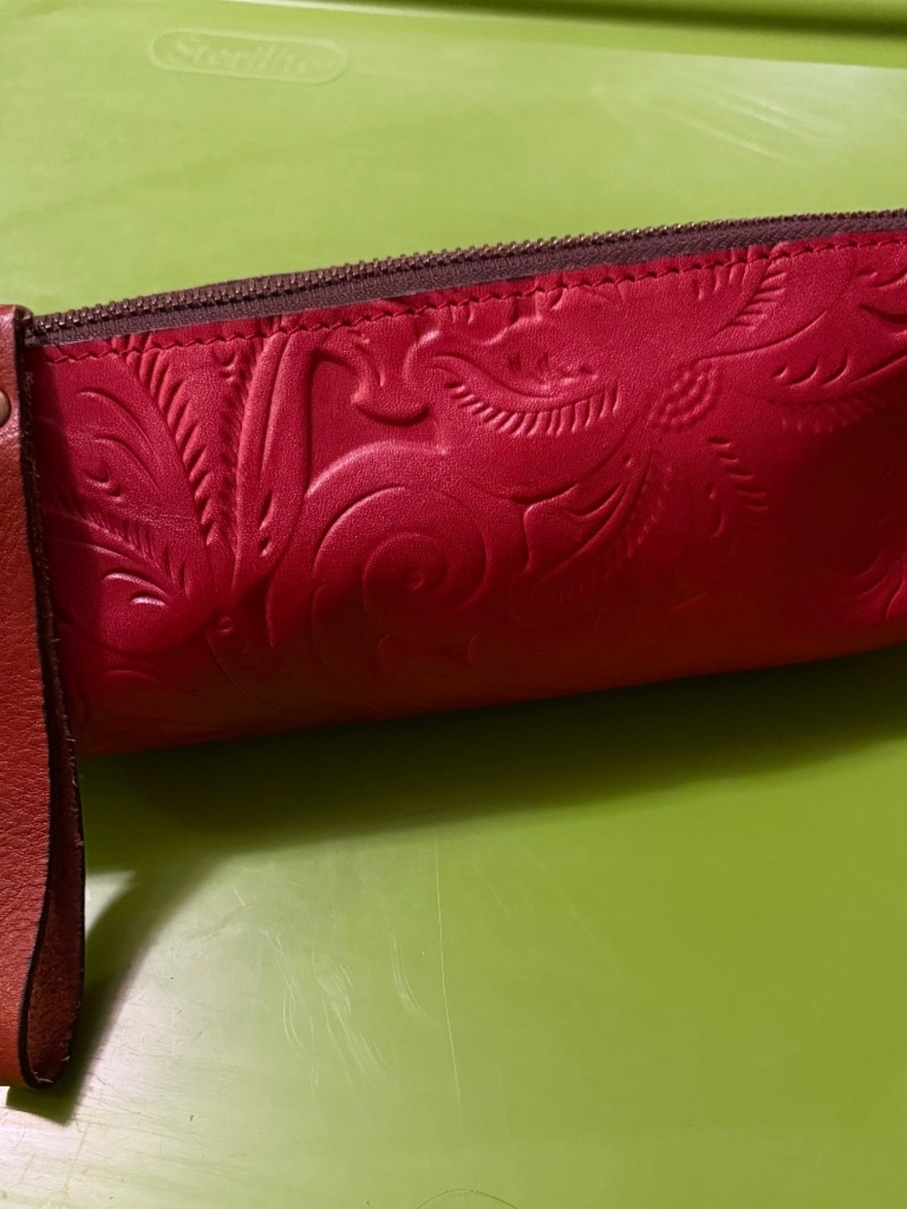 Genuine leather, tooled Accessories bag,